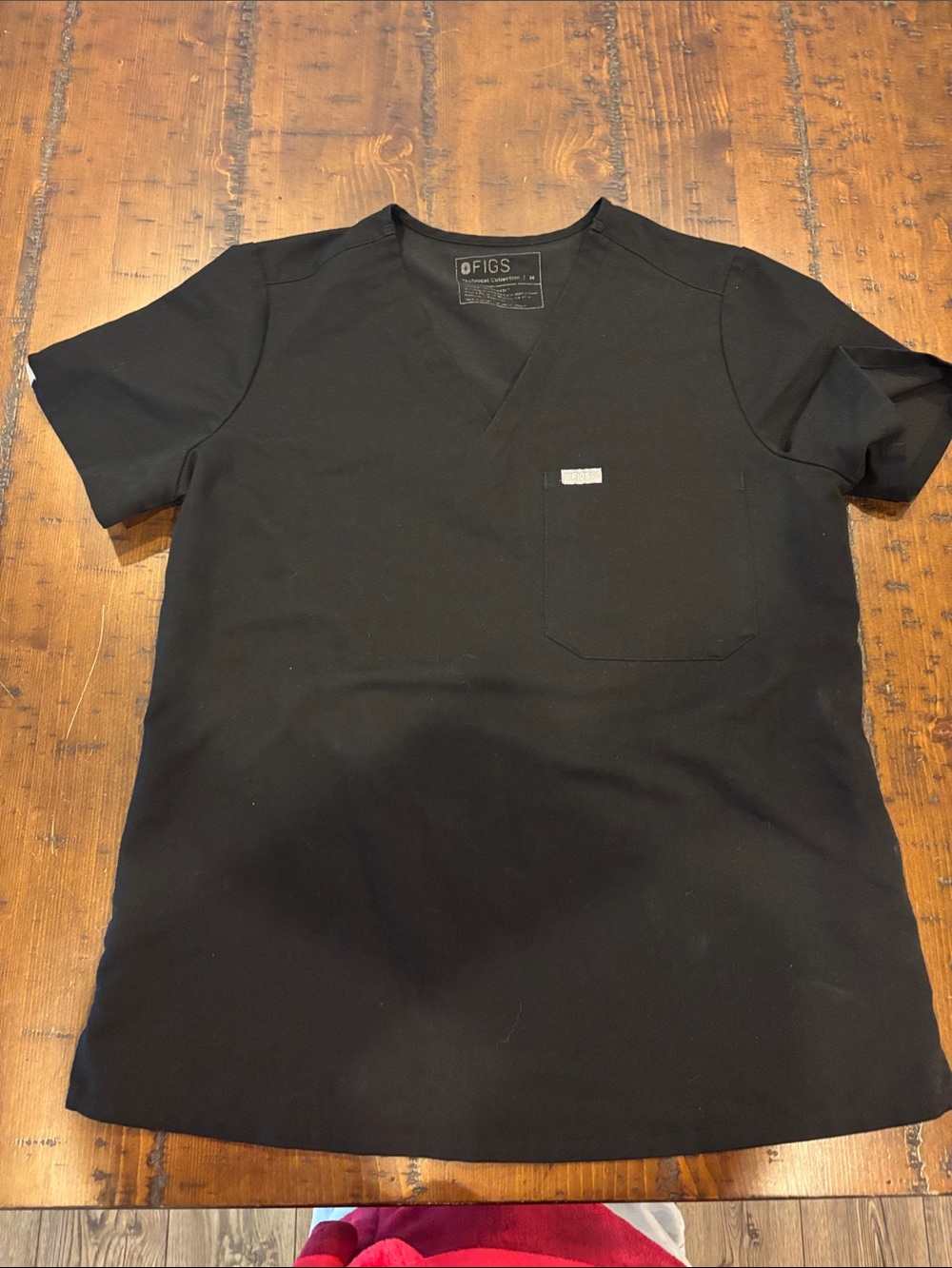 FIGS Black Short-Sleeve V-Neck Scrub Top. Size medium.
